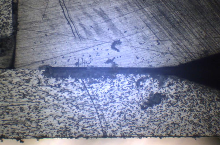 Initial tool engagement with the sample surface prior to controlled material removal