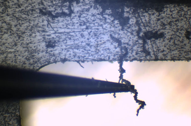 Semi-automated surface cutting in progress, showing controlled removal of material from the target region